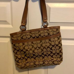 Medium Coach insignia purse. Size is 13“ x 11 1/2“. Like new condition